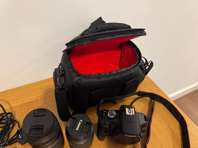 Canon EOS 2000D DSLR camera with two canon lenses.