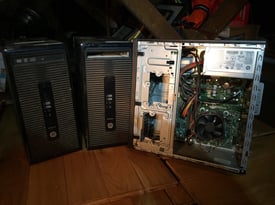 Three HP ProDesk PC towers