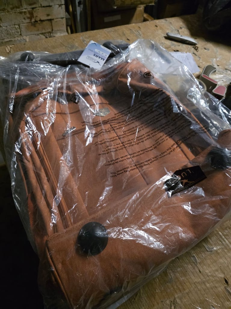 A new still packed  large soft cabin bag with lots of storage and it has 2 wheels and a 