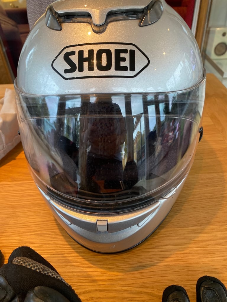 Men’s motorcycle helmet , and two pairs of gloves. 