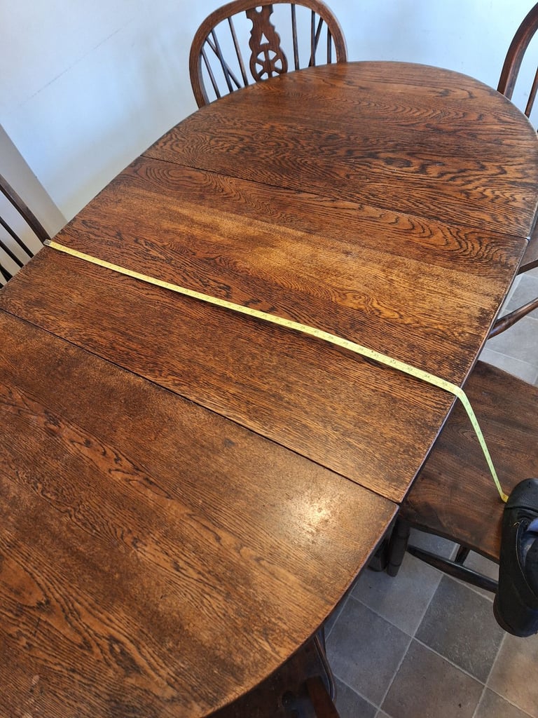 Table and 6 chairs. Vintage, oak gateleg table and wheel back chairs. Willing to split set
