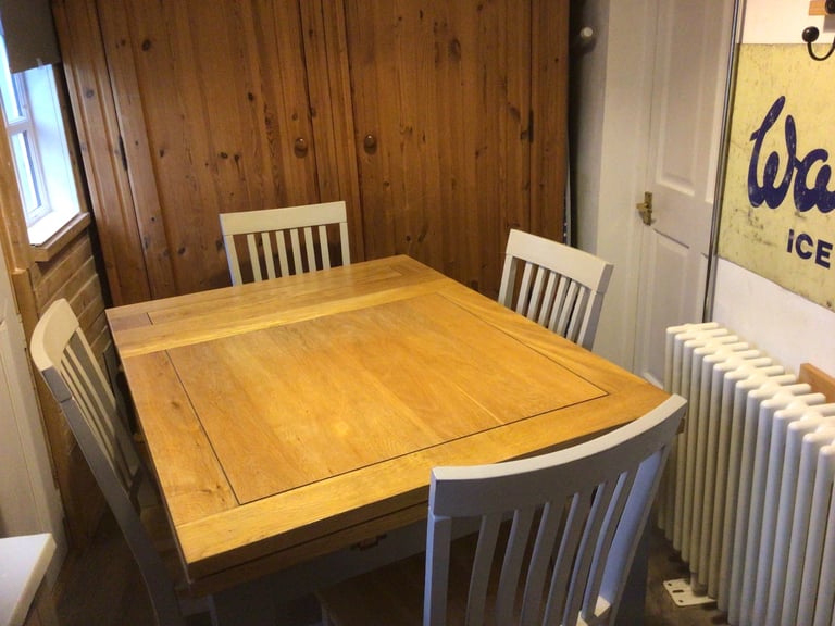 Solid oak table and 4 chairs 