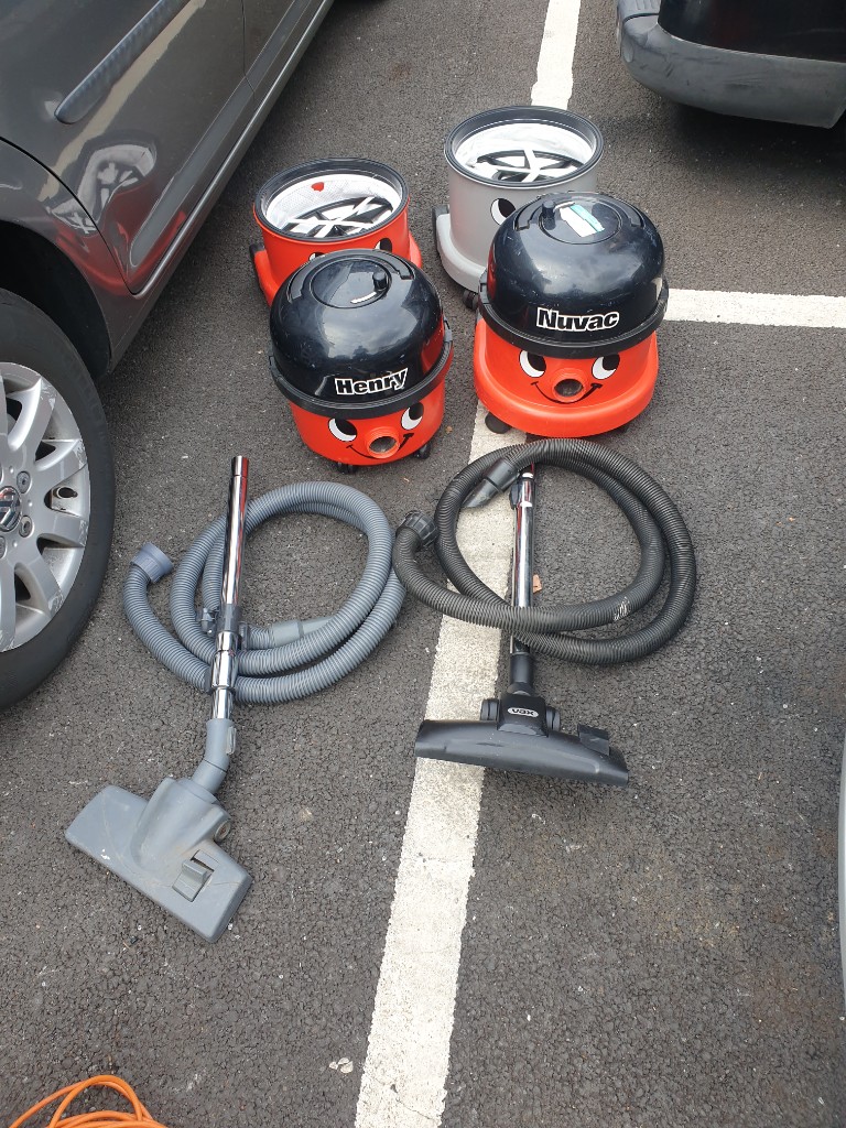 2 faulty henry hoovers and 2 backets with filters they turn on but work with issue