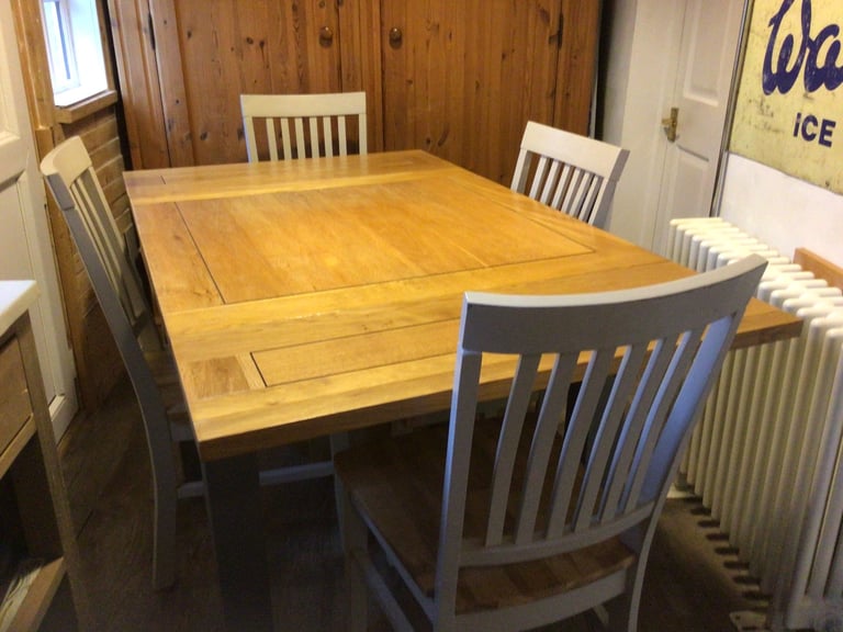 Solid oak table and 4 chairs 