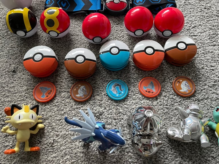 Job lot of pokemon balls figures belt disc launchers