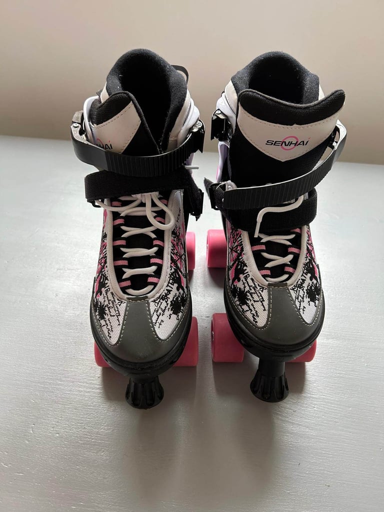 Blindside adjustable quad skates size 4-7 with safety gear.