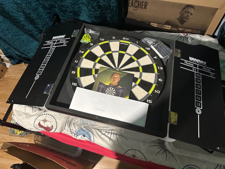 (Brand New) WINMAU Michael Van Gerwen MVG Dartboard With Cabinet, Darts and Accessories
