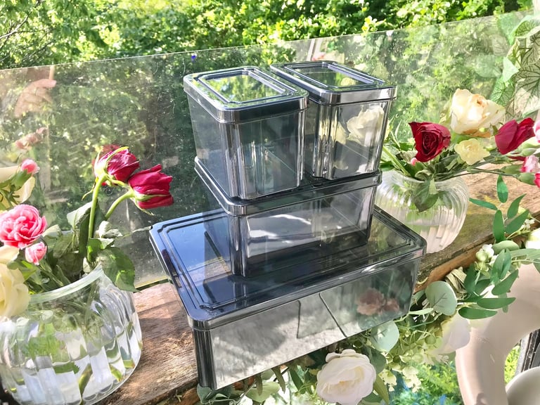 Good quality. Set of 4 Black tint plastic storage boxes Only used a few times