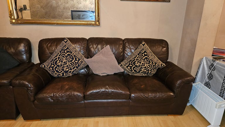 Dark brown 3+2 seater leather sofas.
