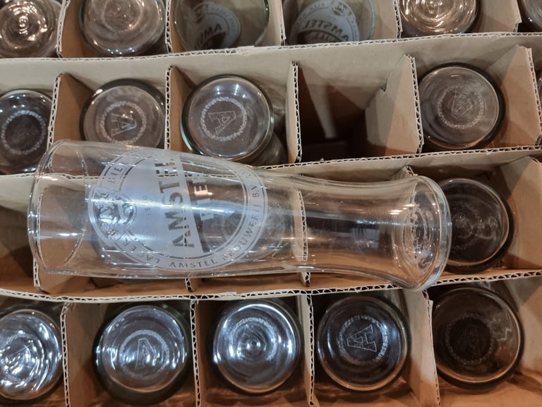 Brand new amstel bier pint glass 