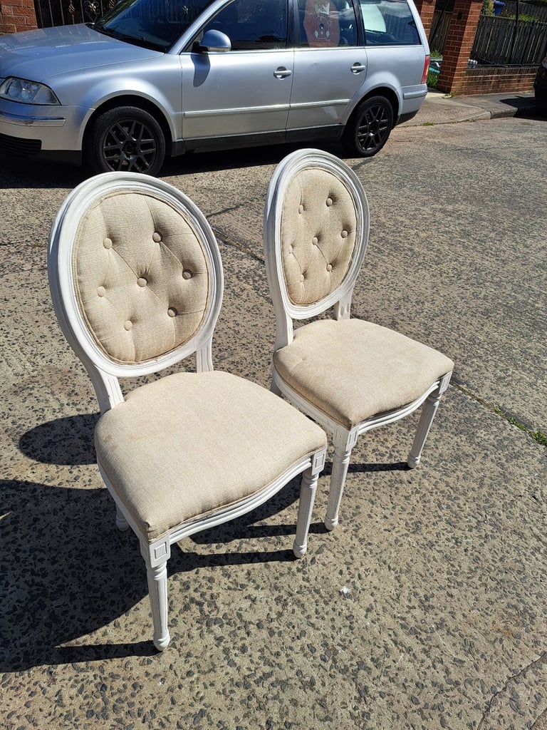 image for 2 white wood framed chairs with cream padded seats and backs