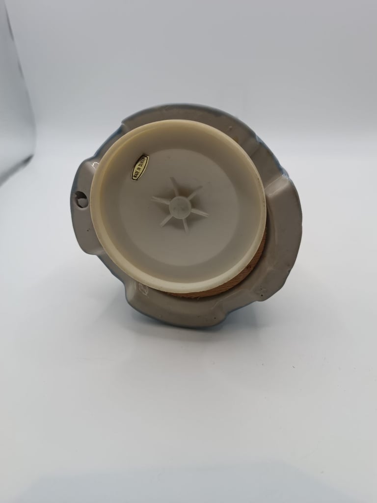 Vintage blue and white ceramic music drummer boy. Turns and music plays