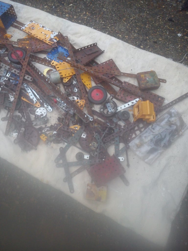 Vintage meccano pieces and literature.