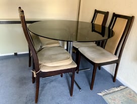 Round glass top table and four dinning chairs