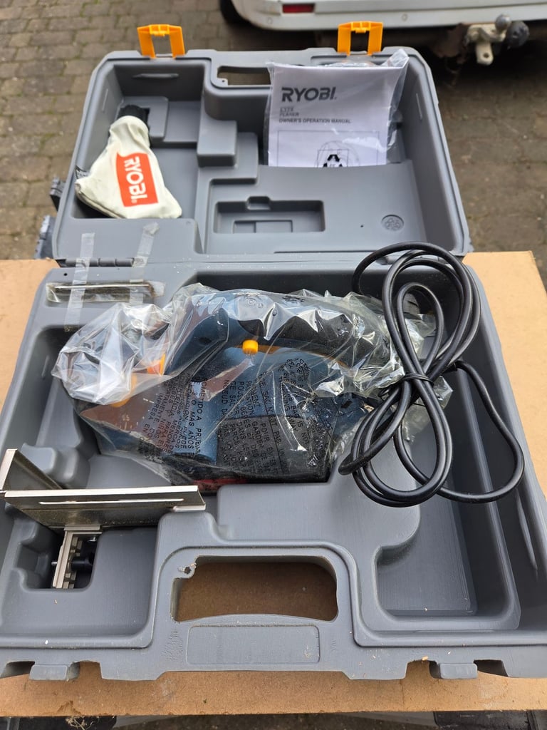 RYOBI ELECTRIC PLANER ( NEVER USED )