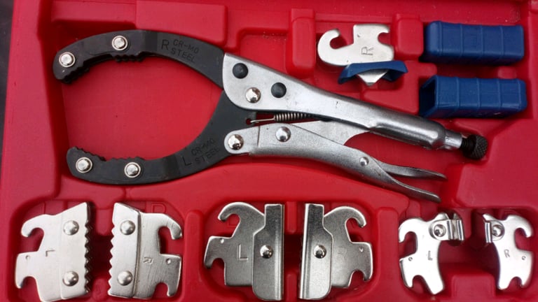 Universal locking clamp, with extra jaws gripping locking onto oil filters etc.