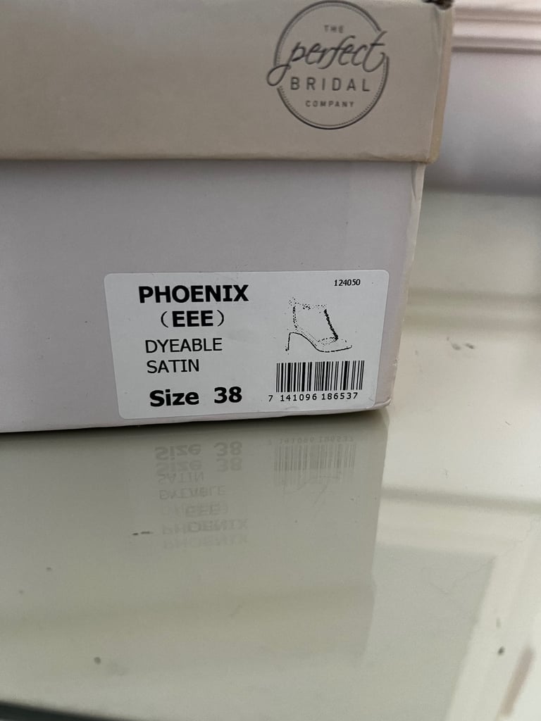 White satin heeled shoes