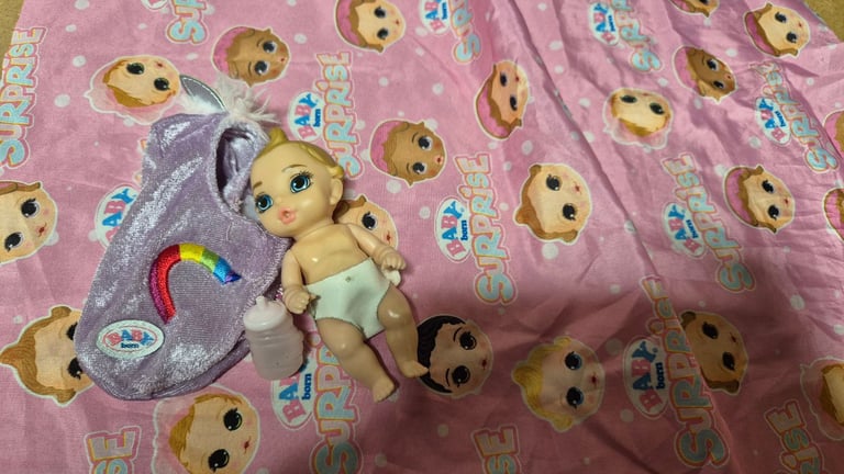 image for Zapf creation Babyborn suprise doll rainbow with swaddle wrap and bottle.