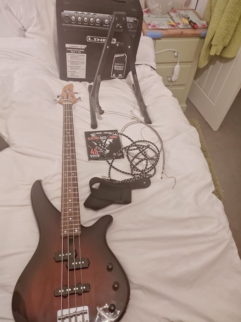 Yamaha RBX170 4 String Bass. Line 6 LD 15watt Bass Amp. Both in Mint Condition . Lots of Extras