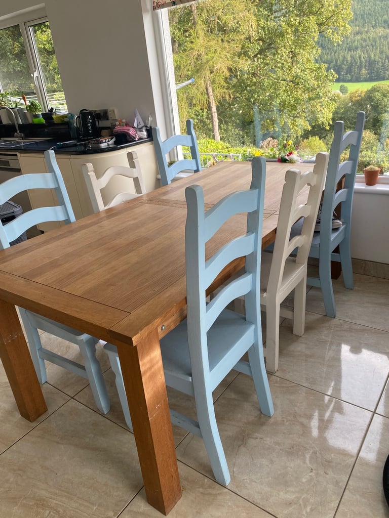 Sold oak 6-8 seater table and chairs -extendable 