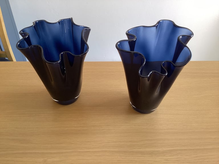 image for A pair of blue glass flower vases. 