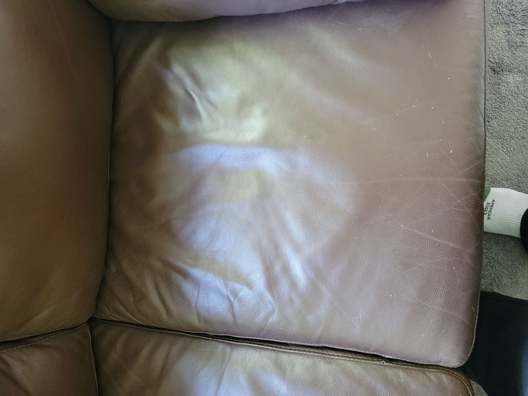 Small brown leather sofa- free