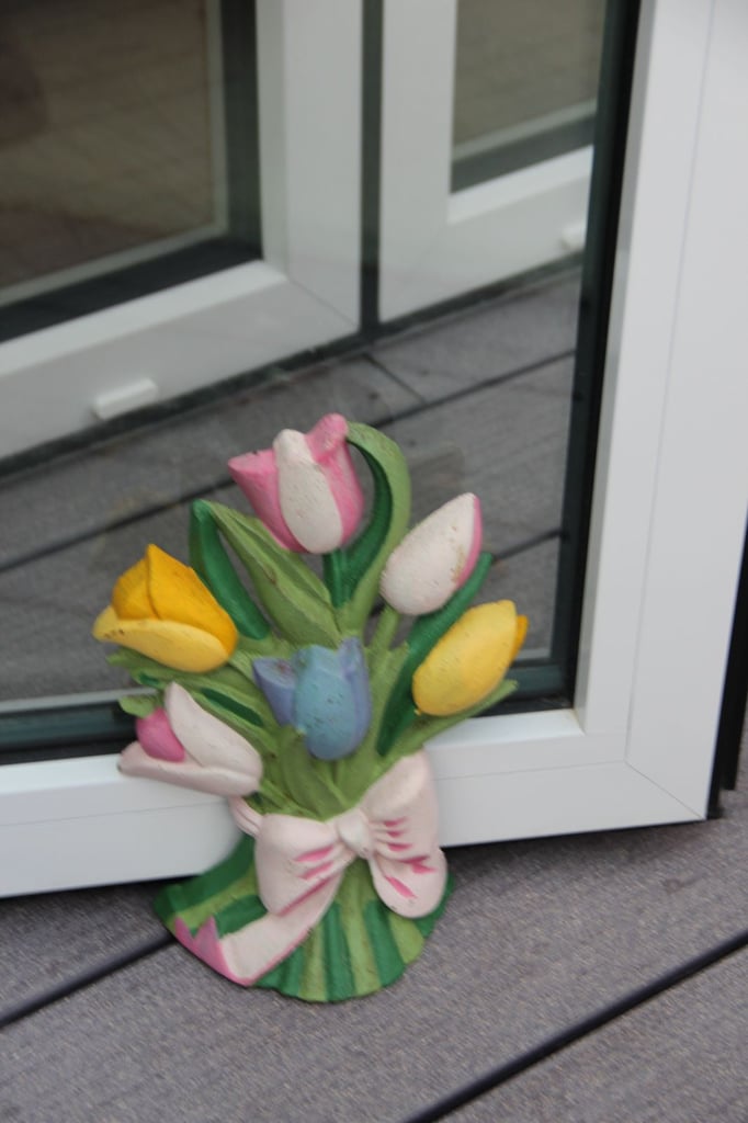 Vintage Painted cast iron Door Stop in Tulip Design.