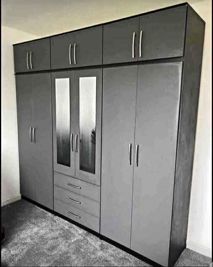 Modern Bedroom Furniture. Bedroom Suit Includes Bedside Tables, Chest of Drawers and Wardrobes