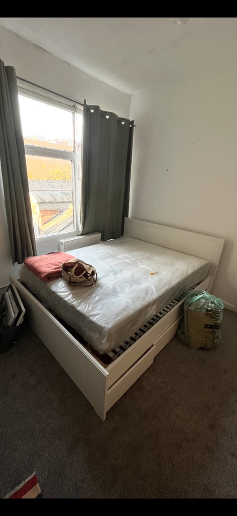 King size white malm bed with 4 storage boxes. Includes mattress