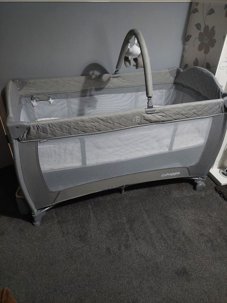 Brand new travel cot