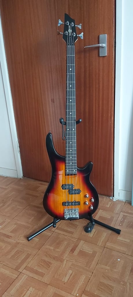 Chicago bass guitar & 15w amp, strap, stand, tuner and padded bag.