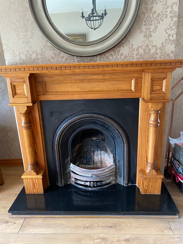 Solid heavy fire surround with black marble hearth