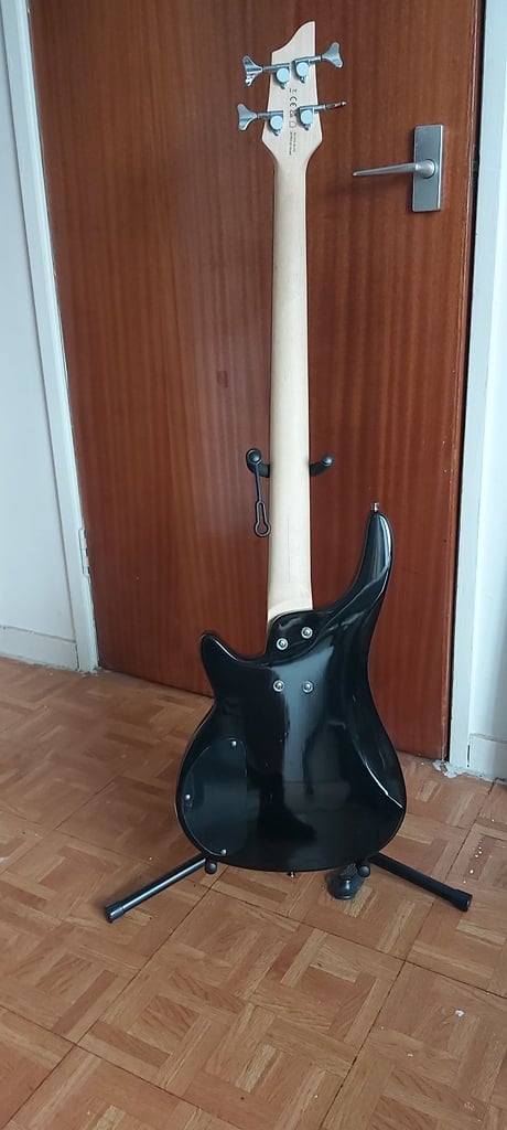 Chicago bass guitar & 15w amp, strap, stand, tuner and padded bag.