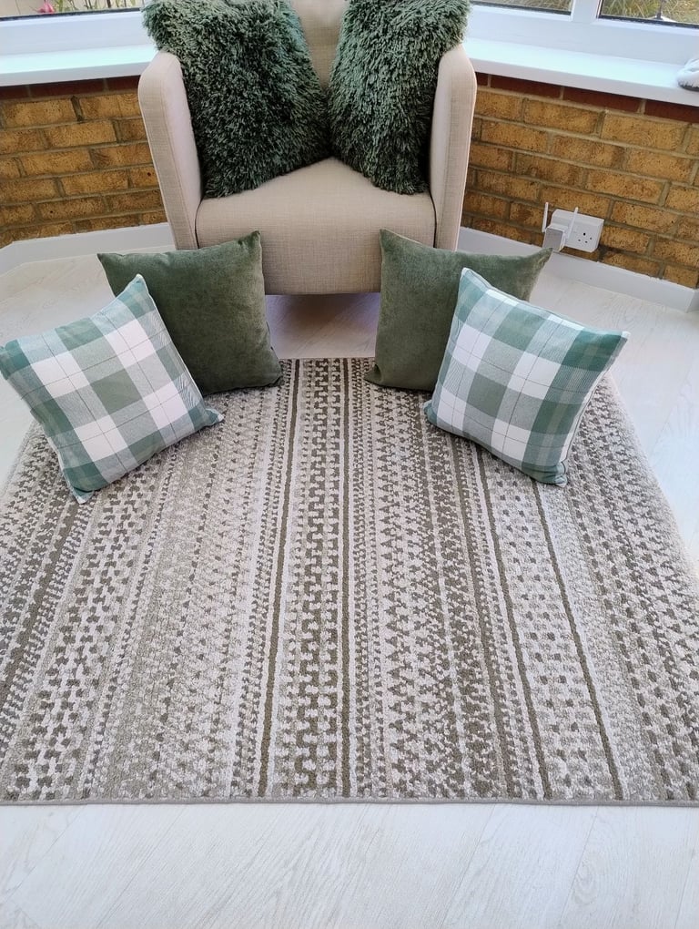 Dunelm rug plus 6 cushions in green colour.