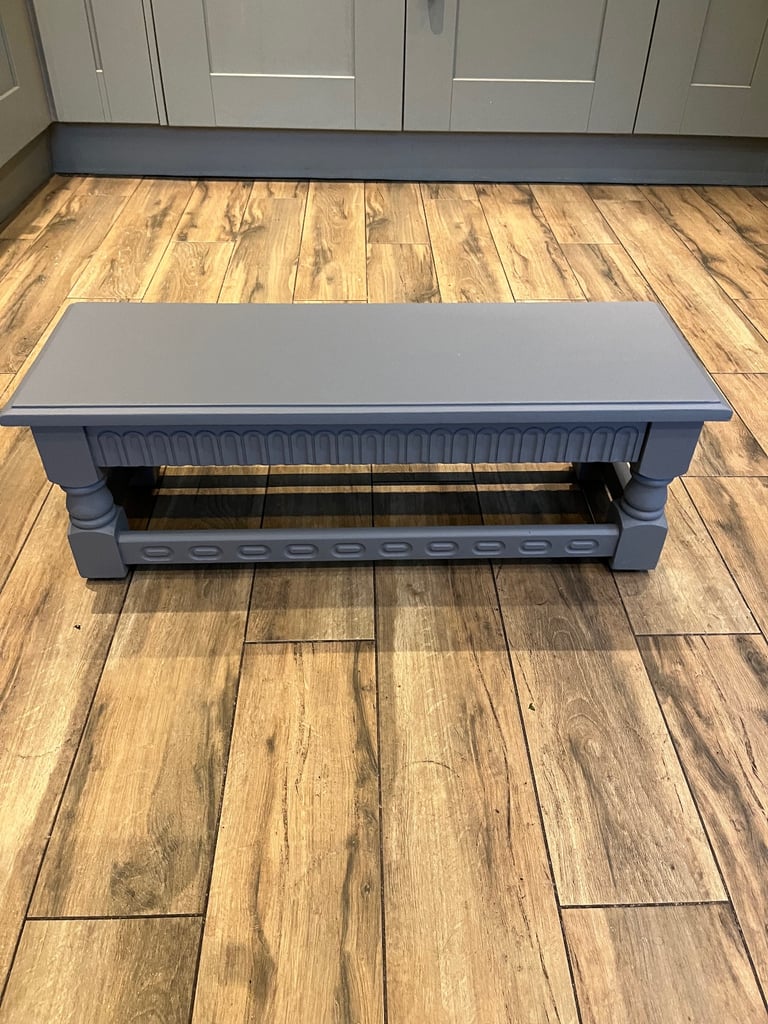 An attractive long and low stool/ bench with nicely turned legs.