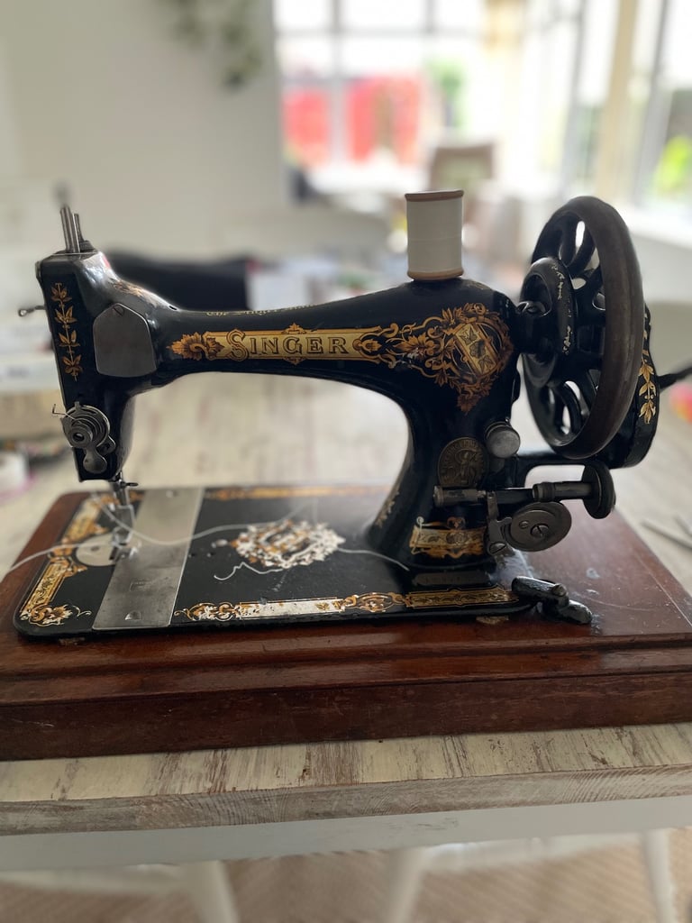 Vintage hand cranked singer sewing machine 