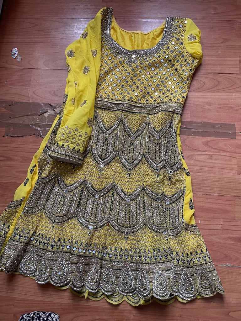 stunning yellow and dark green sharara suit