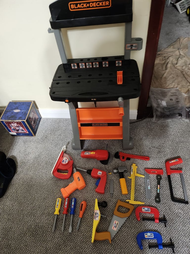 Black and decker work station with toy power tools and other tools 
