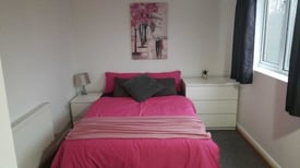 spacious double room with neutral accessories in a professionals only Walsall house-share. 