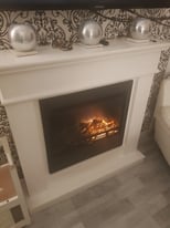 Wood burning effect electric fire with white wood surround