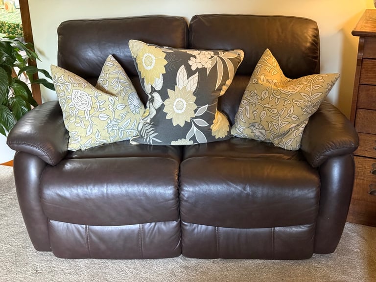 Leather two seater reclining sofa