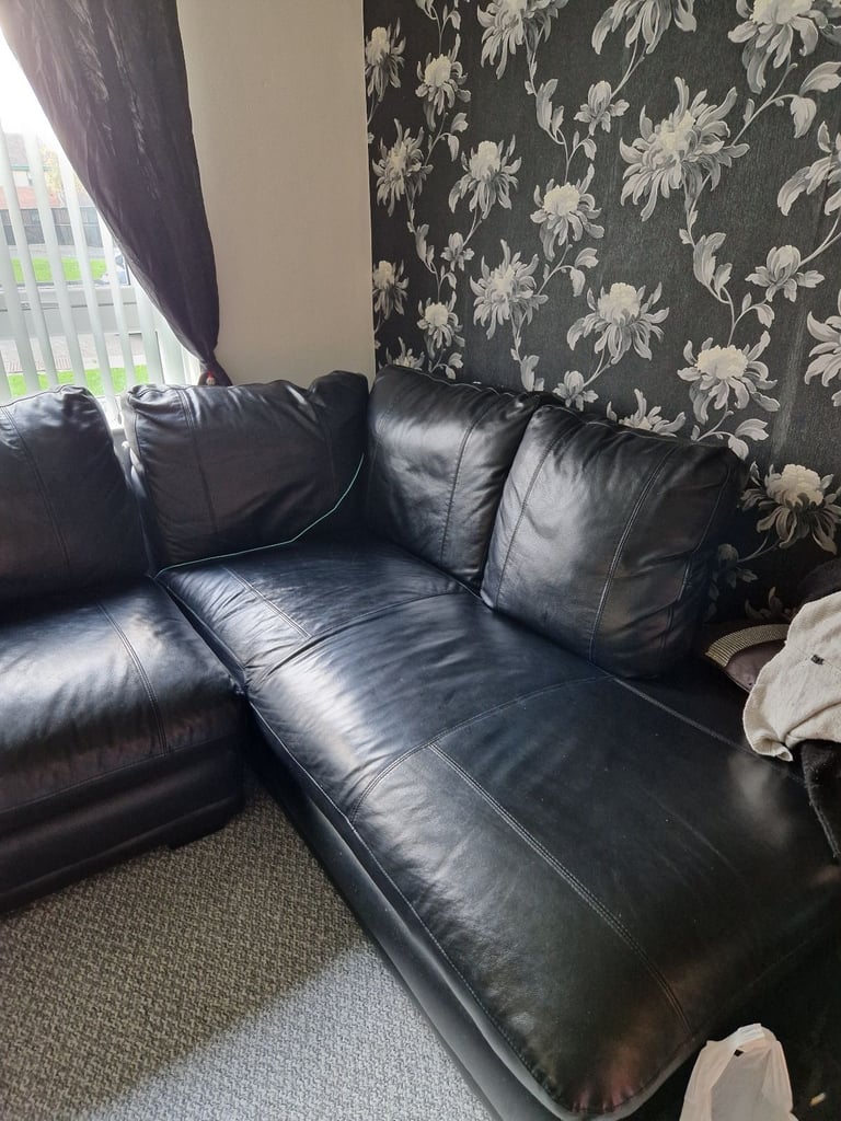 Black leather corner sofa ( SOLD PENDING UPLIFT )