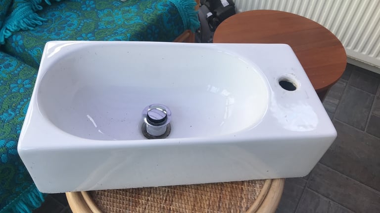 Cloaked, en suite, bathroom sink. 