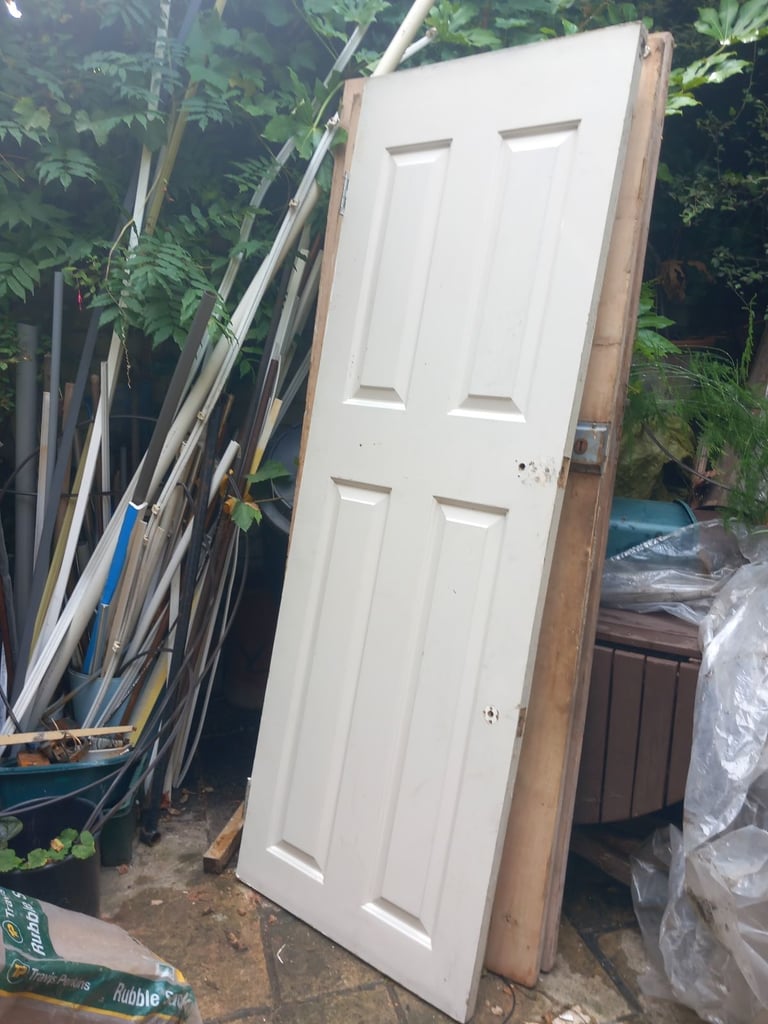 Four panel white wood door.