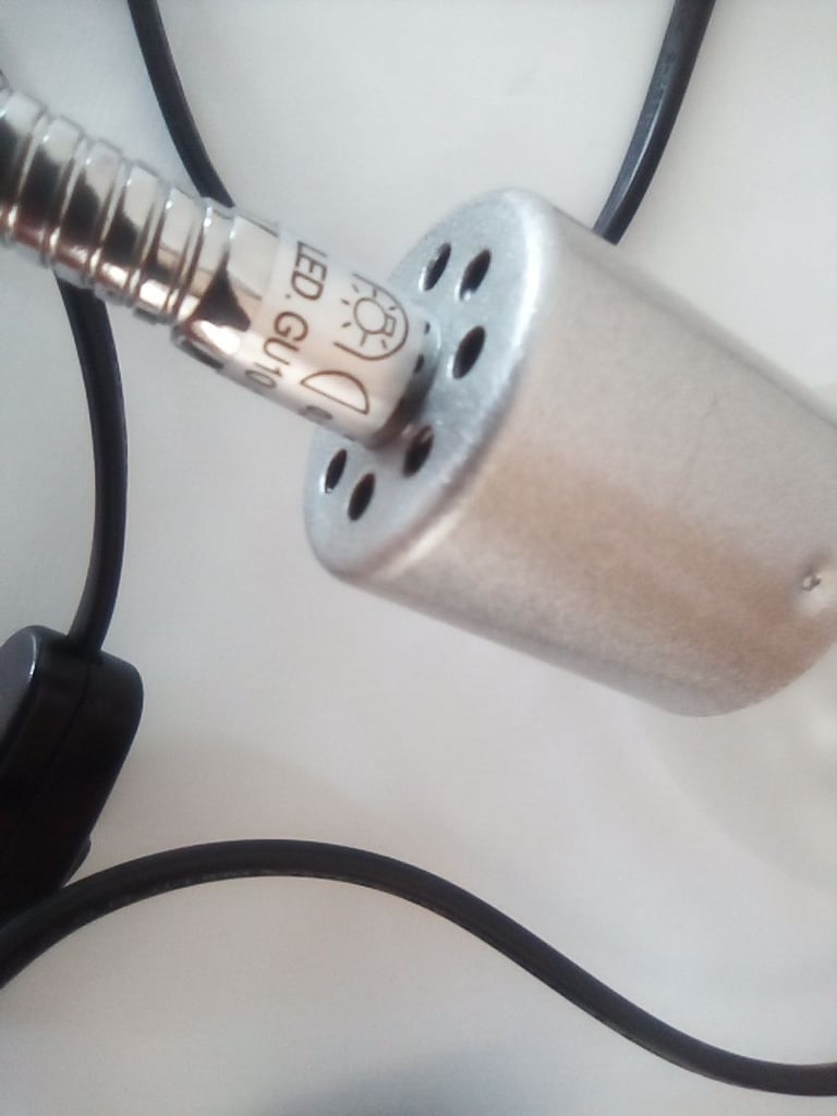 Flexible light, clips onto office desk or work bench.