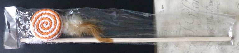 Orange & white swirl cat/kitten toy on a stick
