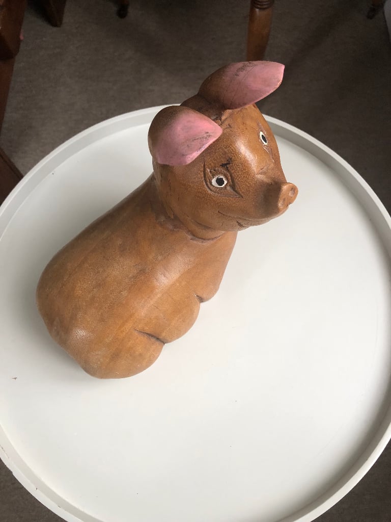 Wooden piglet sculpture 