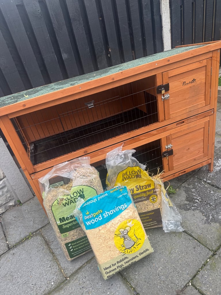 Animal hutch with sliding trays 