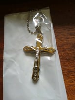 Large New gold and silver plated cross and chain.