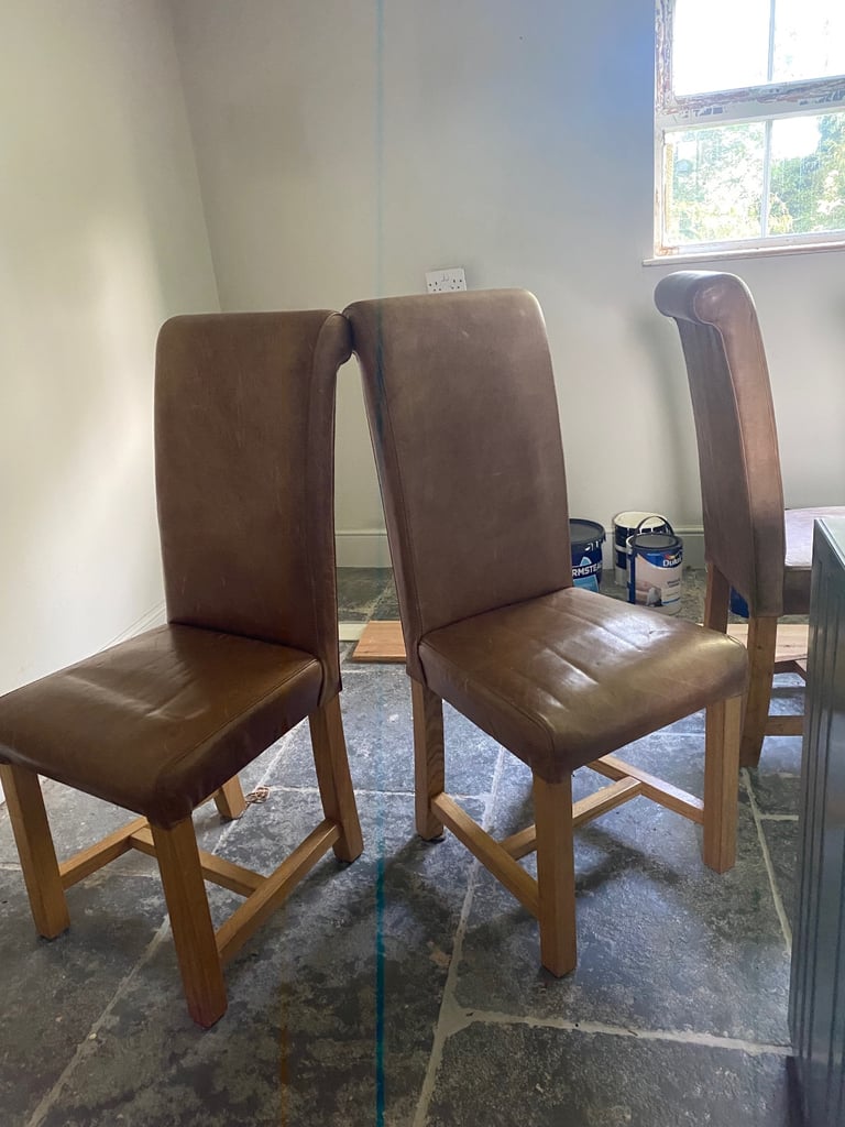 4 Tan leather and wood dining chairs